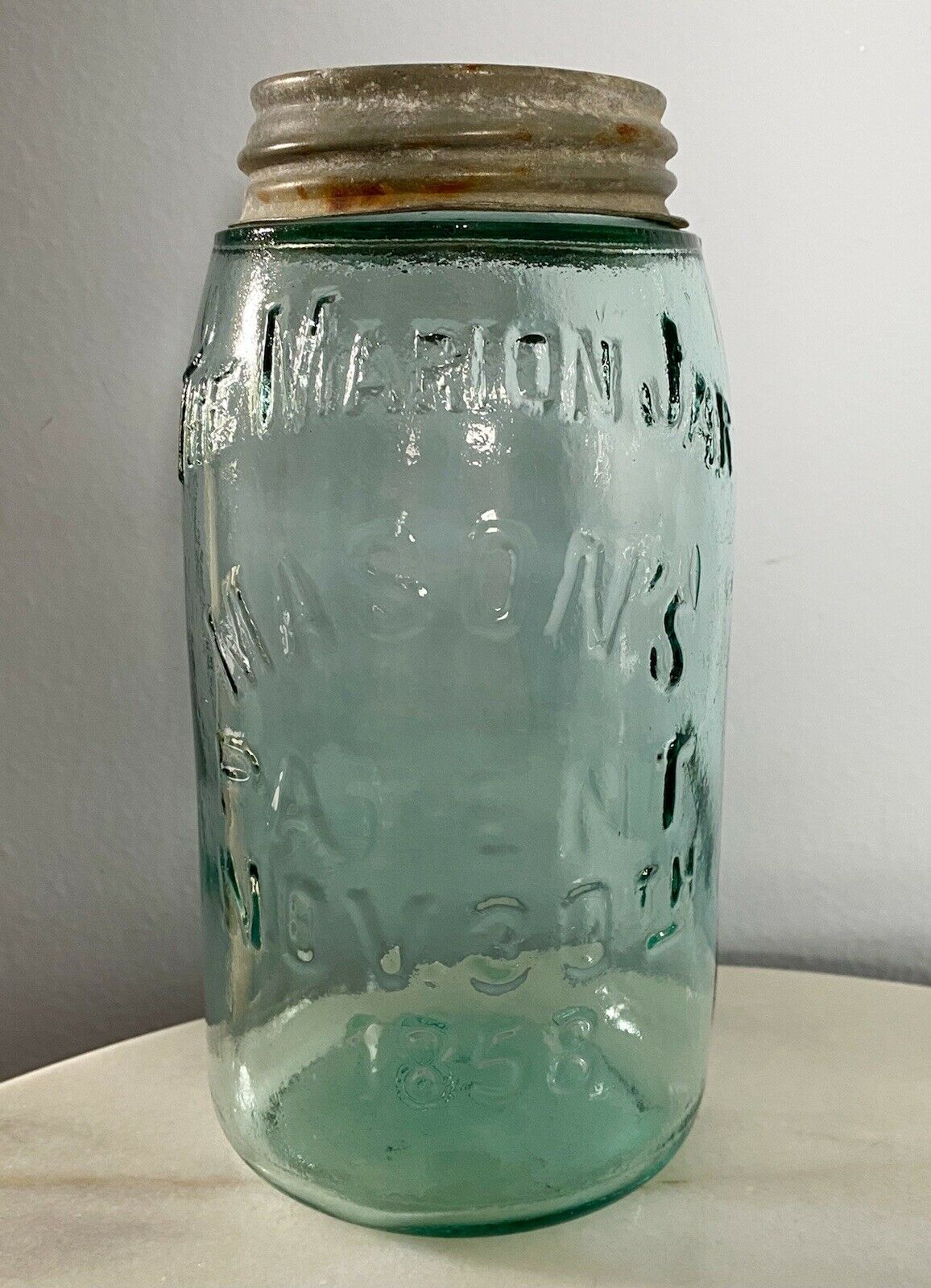 The Marion Jar Mason’s Nov 30, 1858 Quart, #17 Teal Green Bubbles Zinc Glass Lid